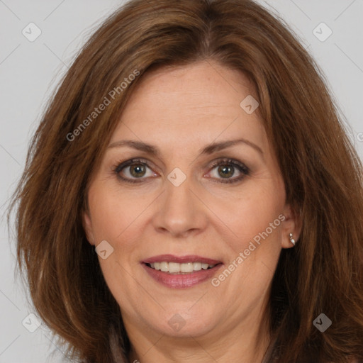 Joyful white adult female with long  brown hair and brown eyes