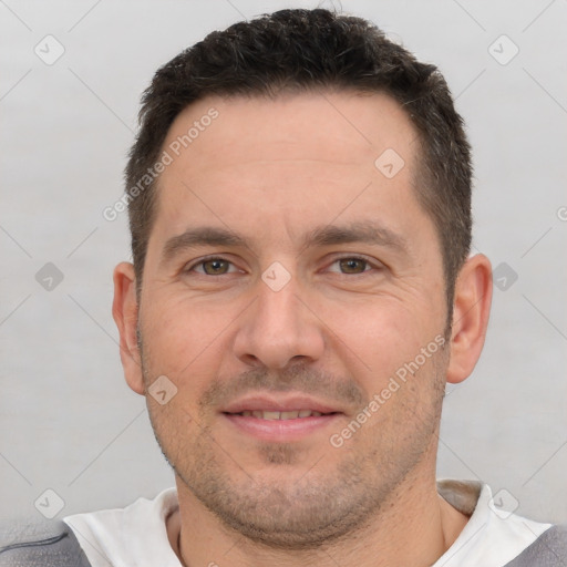 Joyful white adult male with short  brown hair and brown eyes