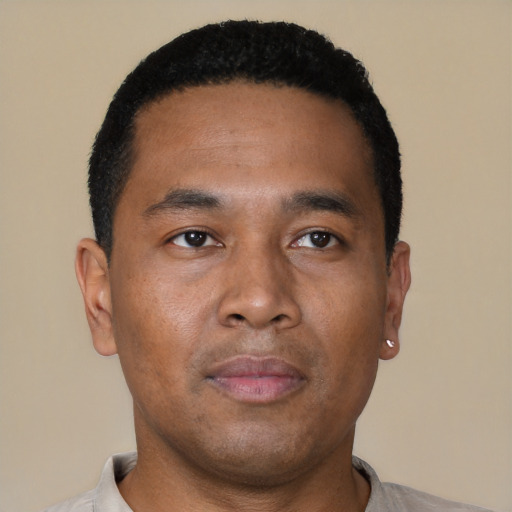 Neutral latino young-adult male with short  brown hair and brown eyes
