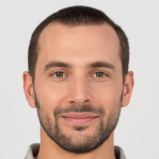 Joyful white young-adult male with short  brown hair and brown eyes