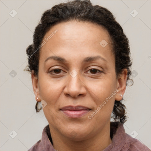 Joyful latino adult female with short  brown hair and brown eyes