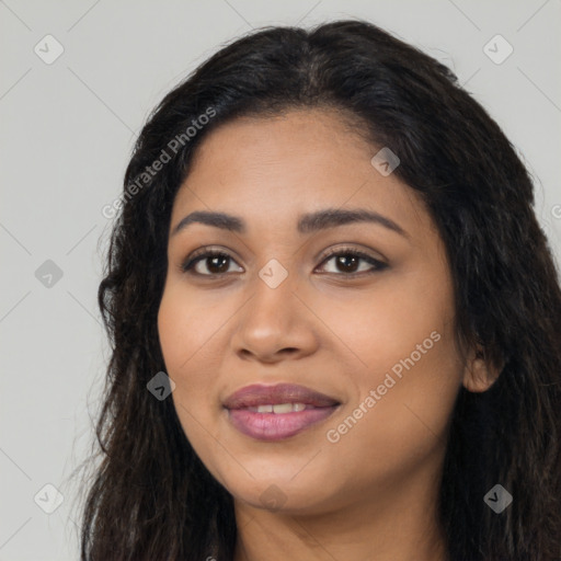 Joyful latino young-adult female with long  black hair and brown eyes