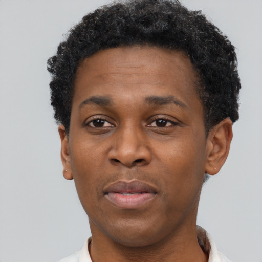 Neutral black adult male with short  brown hair and brown eyes
