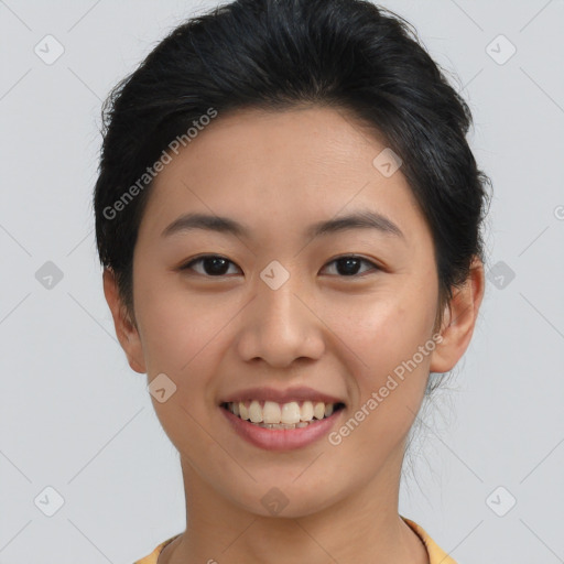 Joyful asian young-adult female with short  brown hair and brown eyes