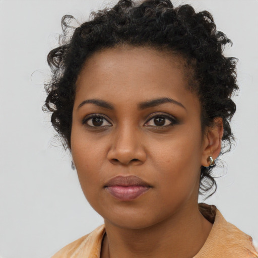 Neutral black young-adult female with long  brown hair and brown eyes