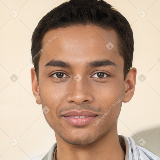 Joyful latino young-adult male with short  black hair and brown eyes