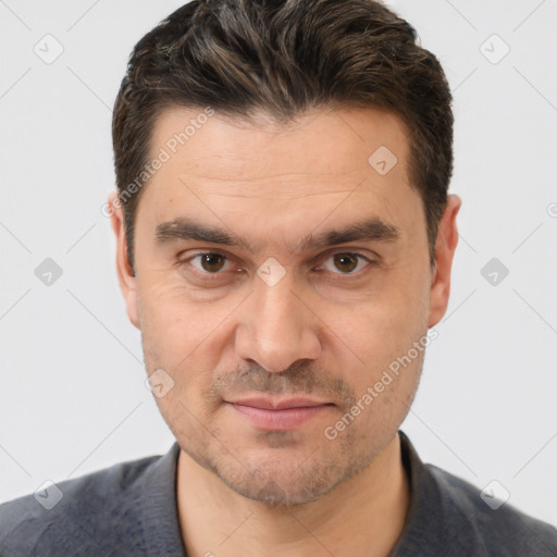 Joyful white adult male with short  brown hair and brown eyes