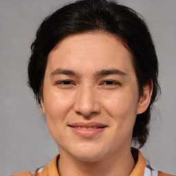 Joyful white adult female with medium  brown hair and brown eyes