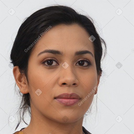 Joyful latino young-adult female with medium  brown hair and brown eyes