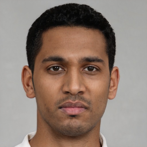 Neutral latino young-adult male with short  black hair and brown eyes