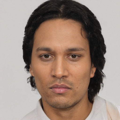 Neutral latino adult male with short  black hair and brown eyes