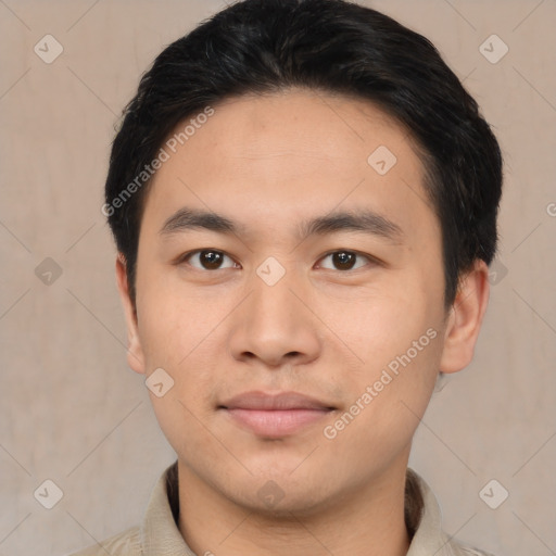 Joyful asian young-adult male with short  brown hair and brown eyes