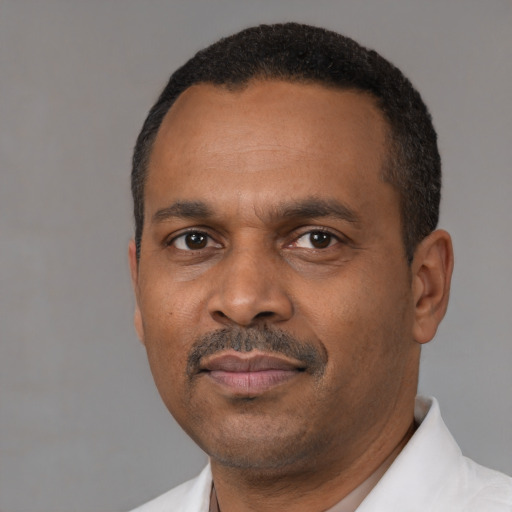 Neutral latino adult male with short  black hair and brown eyes