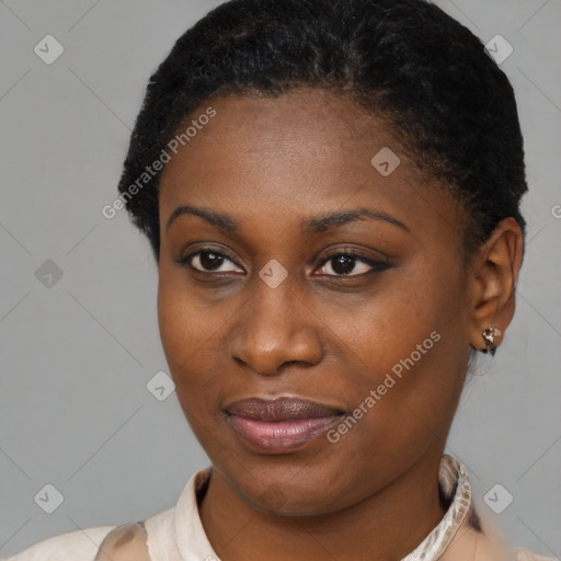 Joyful black young-adult female with short  brown hair and brown eyes