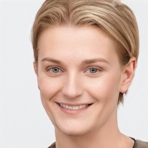 Joyful white young-adult female with short  brown hair and grey eyes