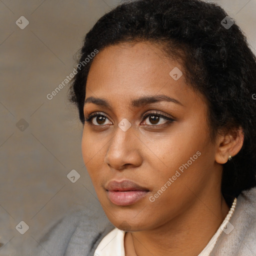 Neutral black young-adult female with short  brown hair and brown eyes