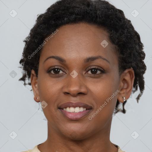 Joyful black young-adult female with short  brown hair and brown eyes