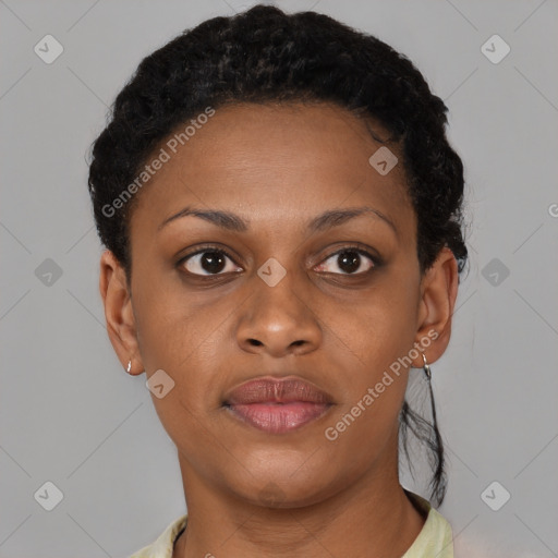 Joyful black young-adult female with short  brown hair and brown eyes