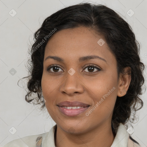 Joyful black young-adult female with medium  brown hair and brown eyes