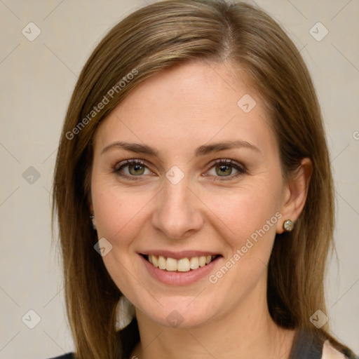 Joyful white young-adult female with medium  brown hair and green eyes