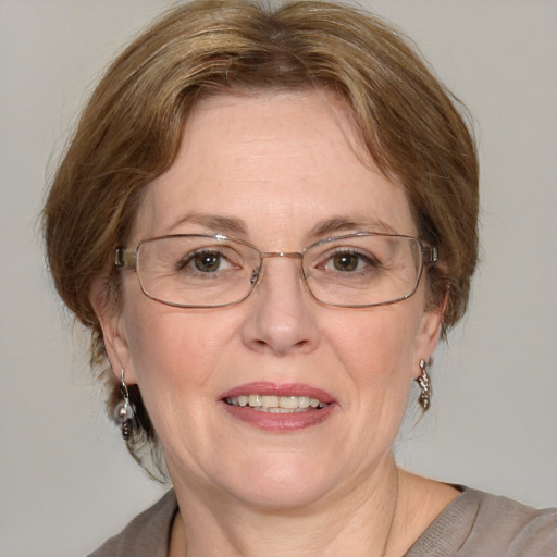 Joyful white middle-aged female with medium  brown hair and blue eyes