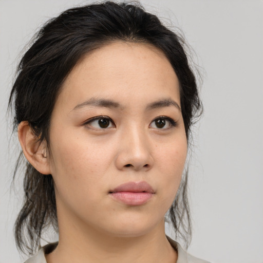 Neutral asian young-adult female with medium  brown hair and brown eyes