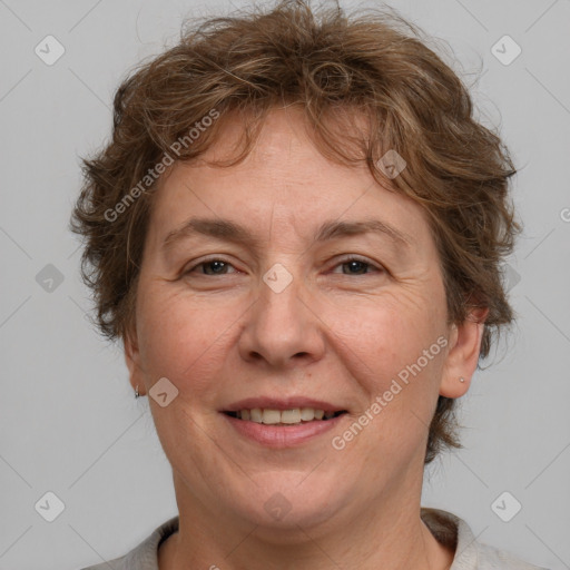 Joyful white adult female with short  brown hair and brown eyes