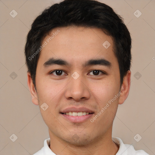 Joyful white young-adult male with short  black hair and brown eyes