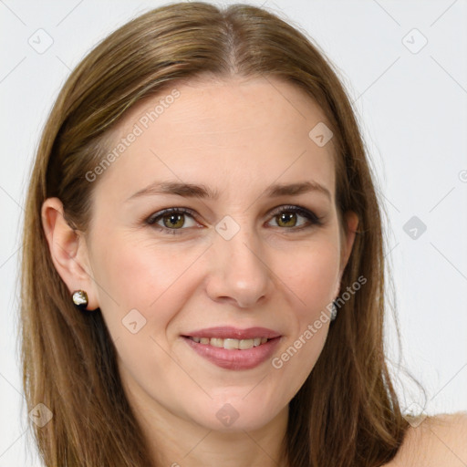 Joyful white young-adult female with long  brown hair and green eyes