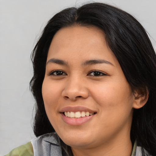 Joyful asian young-adult female with medium  brown hair and brown eyes