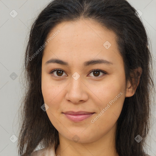 Joyful latino young-adult female with long  brown hair and brown eyes