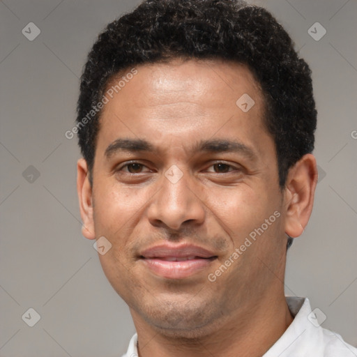 Joyful latino adult male with short  brown hair and brown eyes