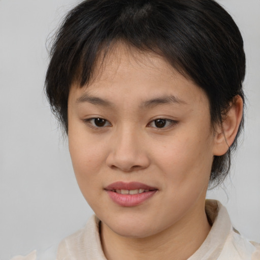 Joyful white young-adult female with medium  brown hair and brown eyes