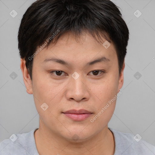 Joyful asian young-adult female with short  brown hair and brown eyes