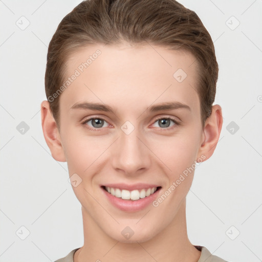 Joyful white young-adult female with short  brown hair and grey eyes