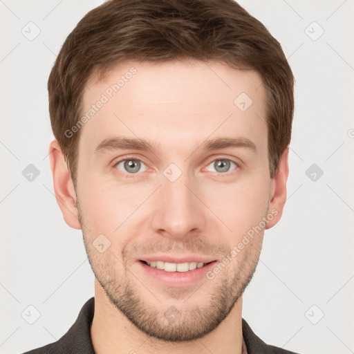 Joyful white young-adult male with short  brown hair and grey eyes