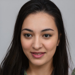 Joyful asian young-adult female with long  brown hair and brown eyes