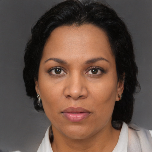 Neutral black adult female with long  brown hair and brown eyes