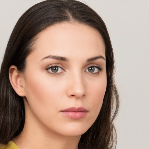 Neutral white young-adult female with long  brown hair and brown eyes