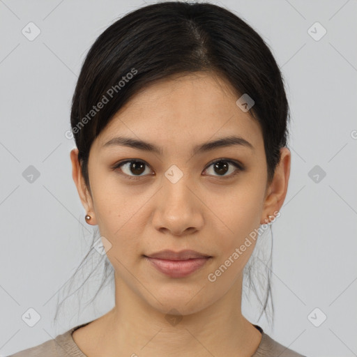 Joyful latino young-adult female with medium  brown hair and brown eyes