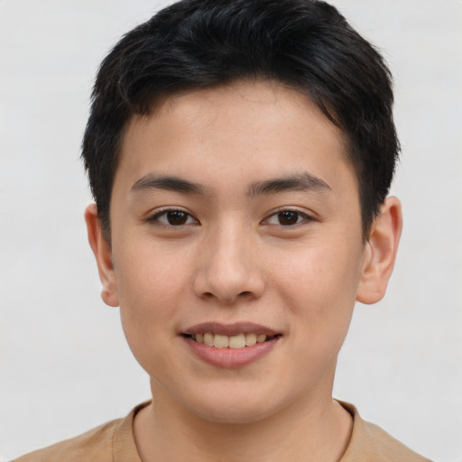 Joyful asian young-adult male with short  brown hair and brown eyes