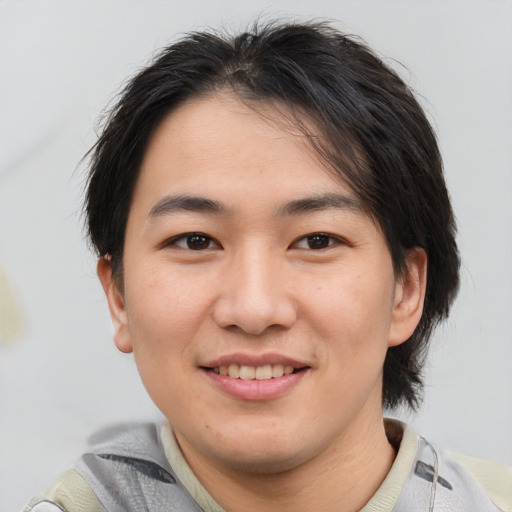 Joyful white young-adult male with medium  brown hair and brown eyes