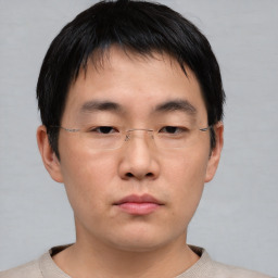 Neutral asian young-adult male with short  brown hair and brown eyes