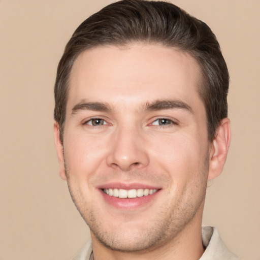 Joyful white young-adult male with short  brown hair and brown eyes