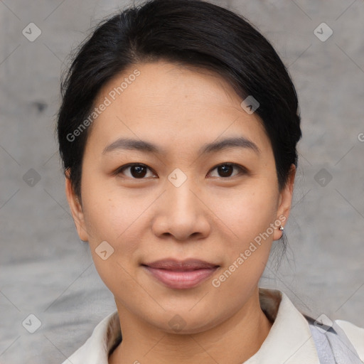 Joyful asian young-adult female with short  brown hair and brown eyes