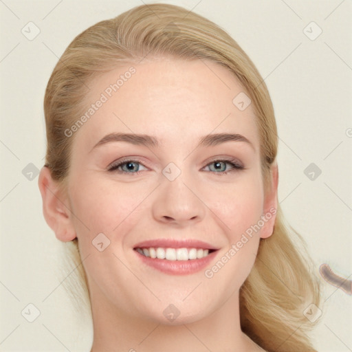 Joyful white young-adult female with medium  brown hair and blue eyes