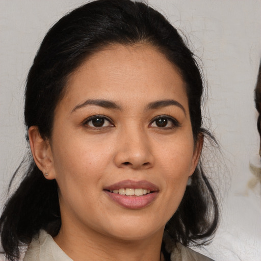 Joyful white young-adult female with medium  brown hair and brown eyes