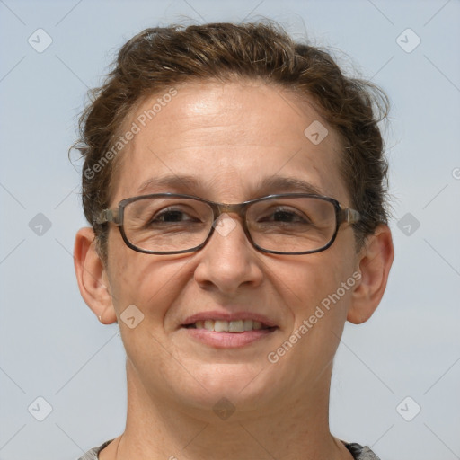 Joyful white adult female with short  brown hair and grey eyes