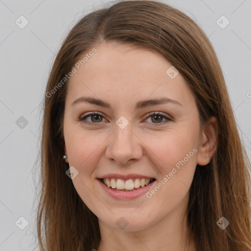 Joyful white young-adult female with long  brown hair and grey eyes