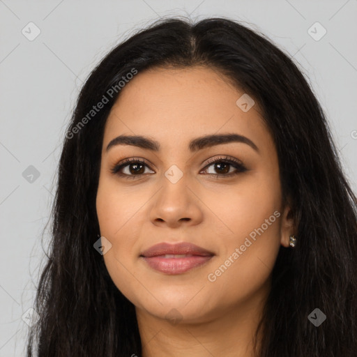 Joyful latino young-adult female with long  black hair and brown eyes